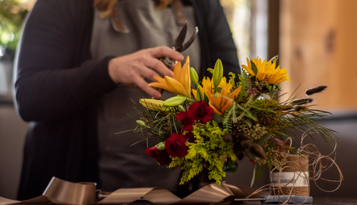 kistners flowers fall arrangement on table